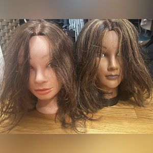 Two human hair mannequin heads